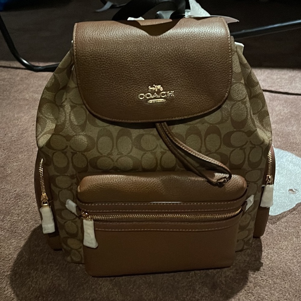 New with tags authentic Coach baby bag never been used from a smoke free home